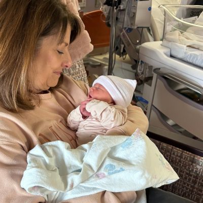 Belinda Pauley holding her newborn grandchild